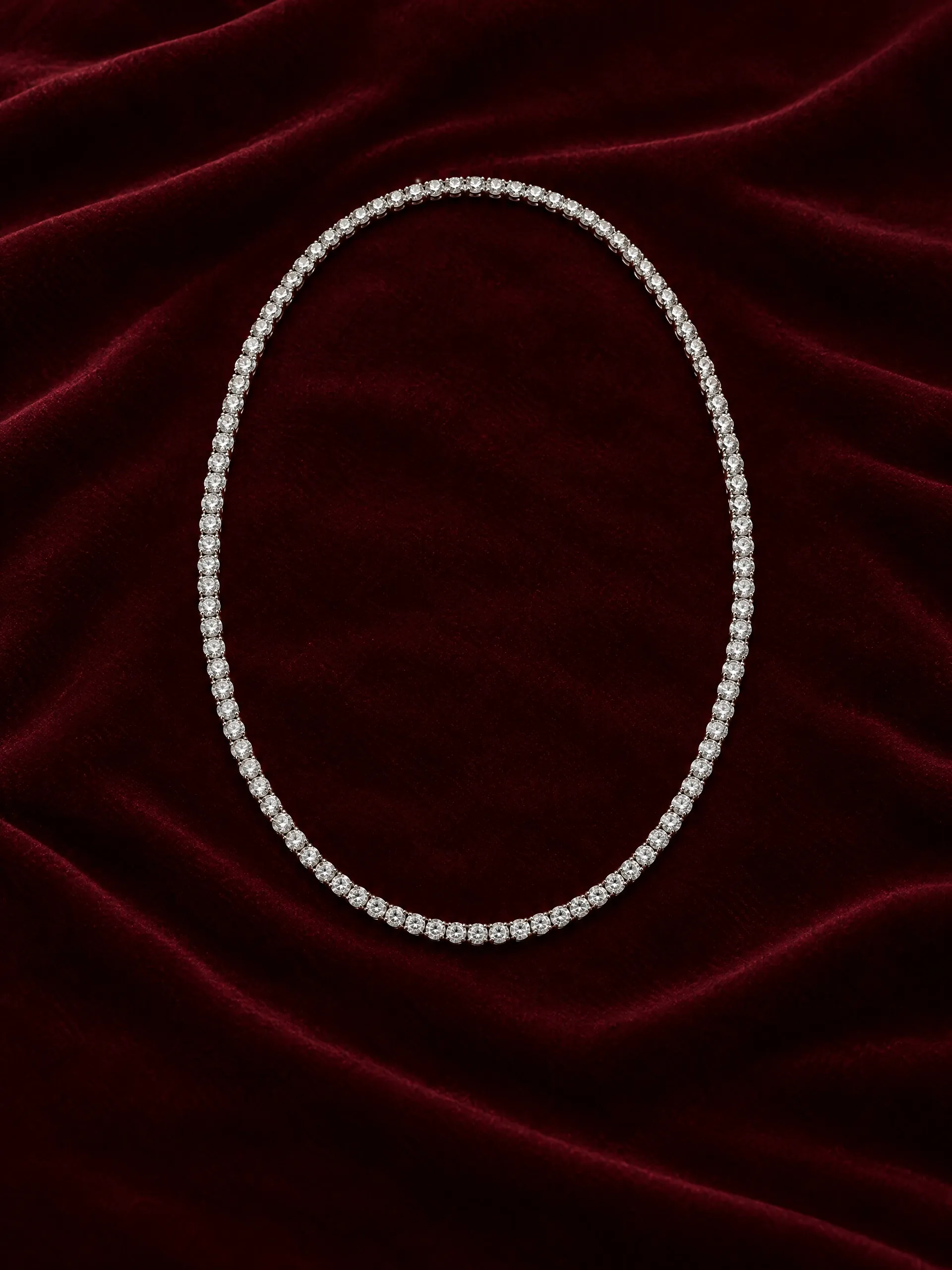 Diamond tennis necklace on burgundy velvet
